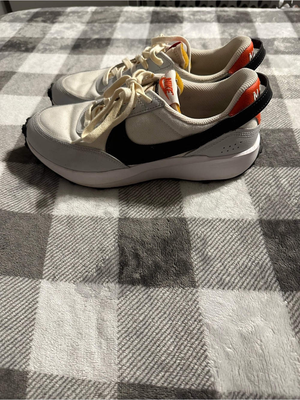 Nike Cream Sneakers with Black Swoosh and Orange Heel